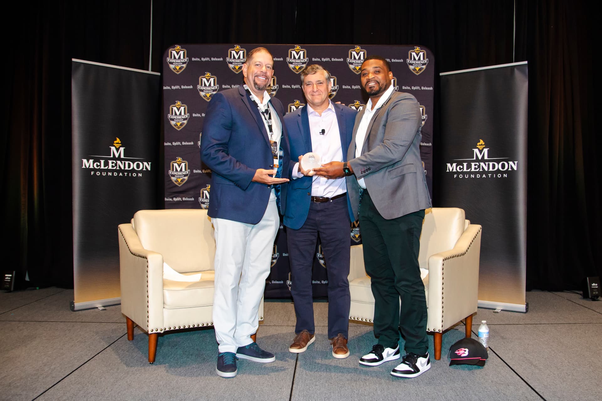 Award presentation on stage at the McLendon Experience 2026