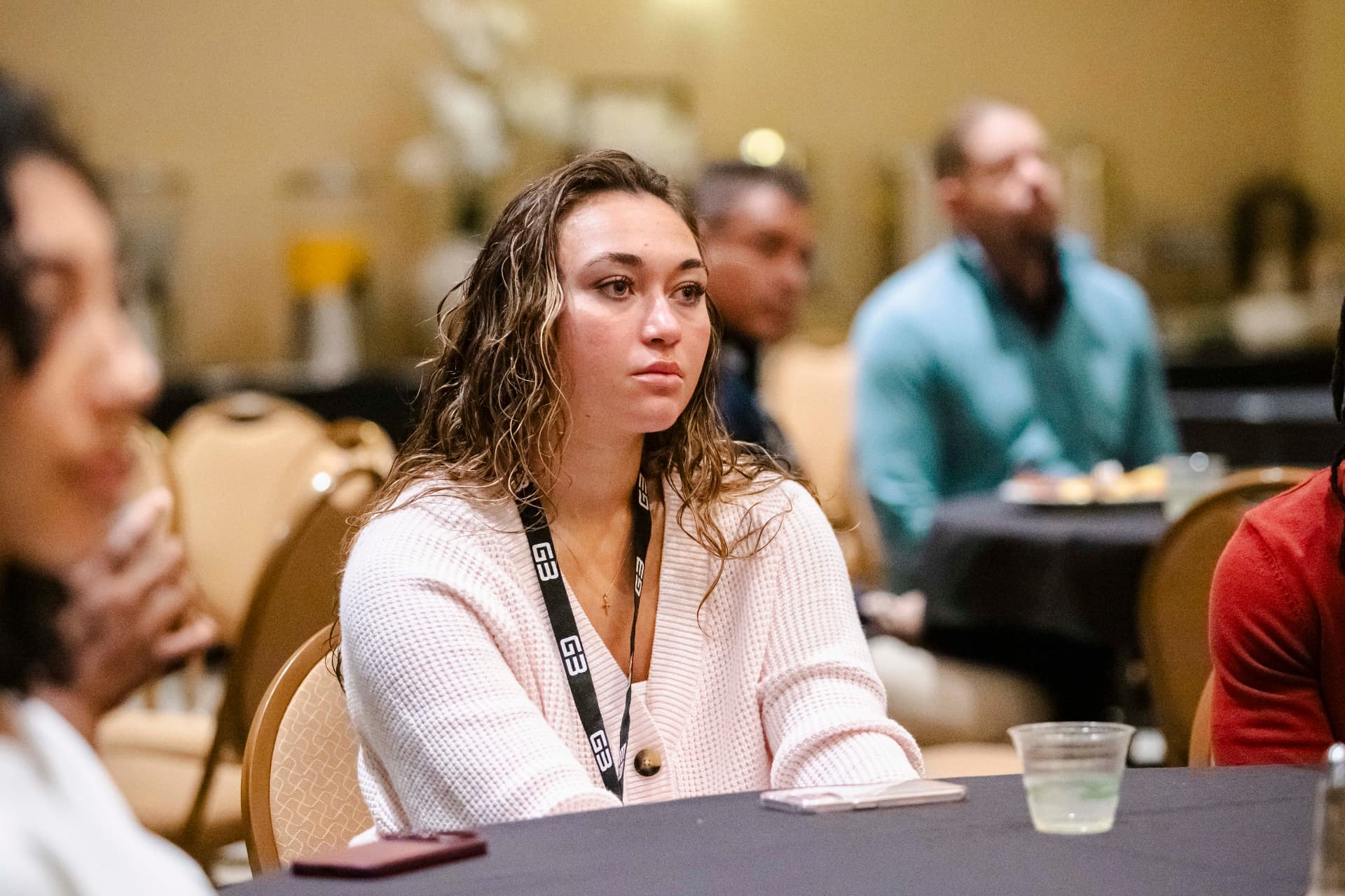 Attendee listening closely during a session