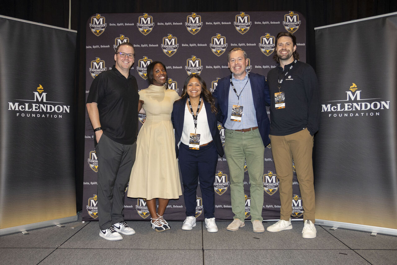 Attendees together beside McLendon Foundation banners at the McLendon Experience 2026