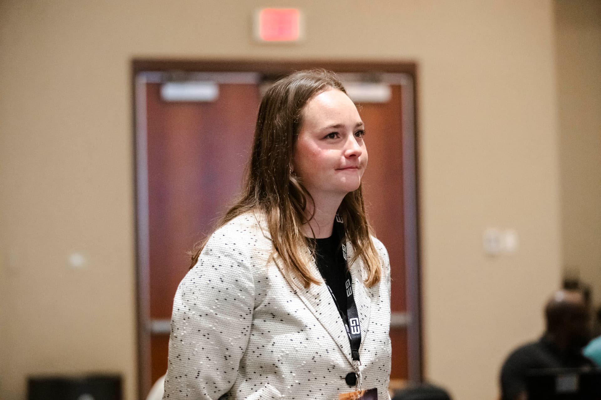 Attendee standing during a session