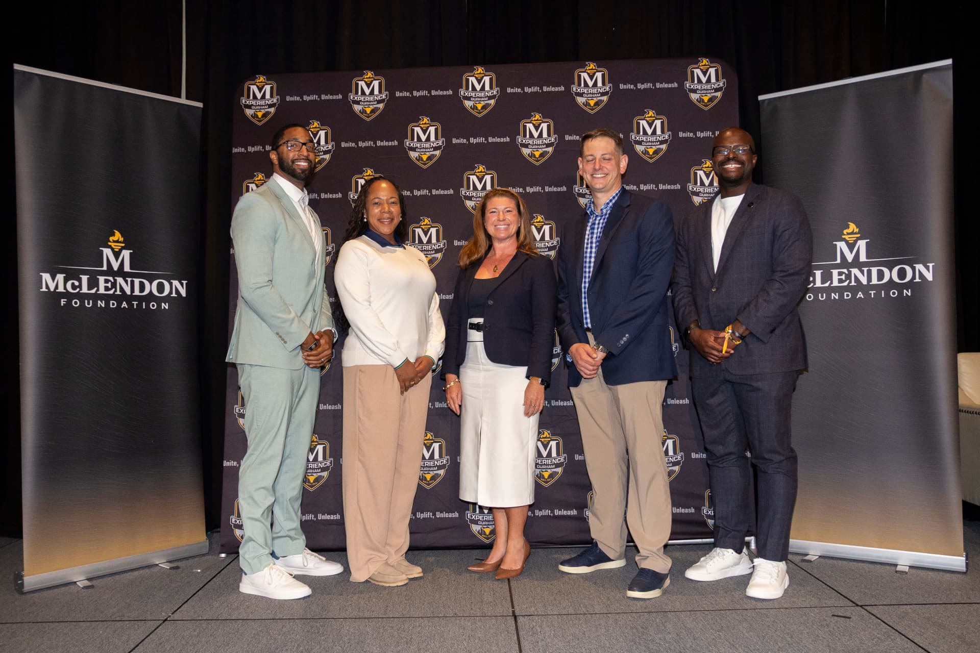 Panelists at the McLendon Experience 2026 backdrop