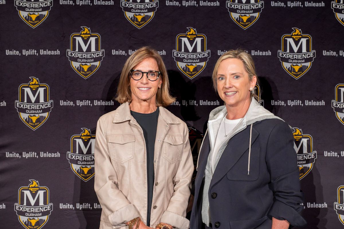 Guests at The McLendon Experience Durham backdrop